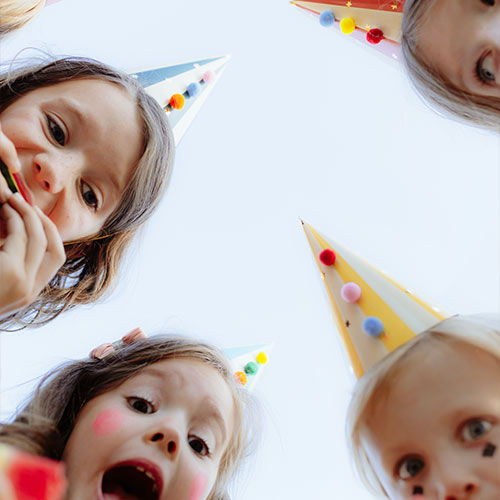 Vibrant Striped Paper Party Hats with Pom Poms - Pack of 6 Product Gallery Image